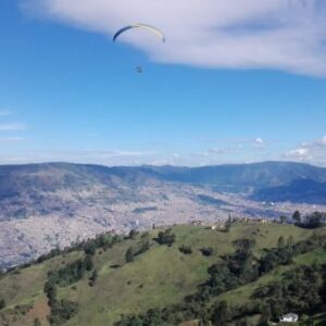 A guy paraglading on the outskirts of Medellin