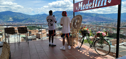 Tourist taking a photo of medellin on a private tour in medellin